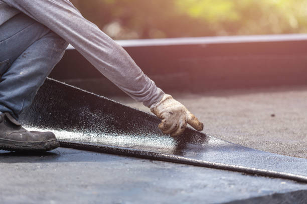 Professional Waterproofing technician working in Cement City, MI